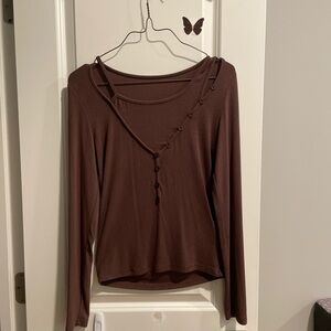 Brown asymmetrical long sleeve top with button details